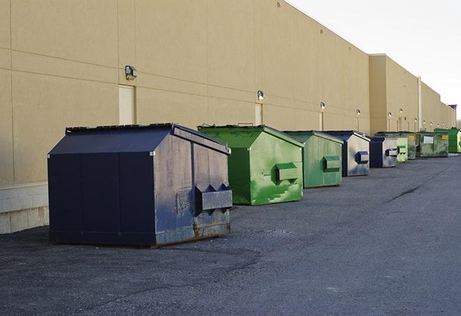 large construction dumpster positioned on a city street in Alafaya